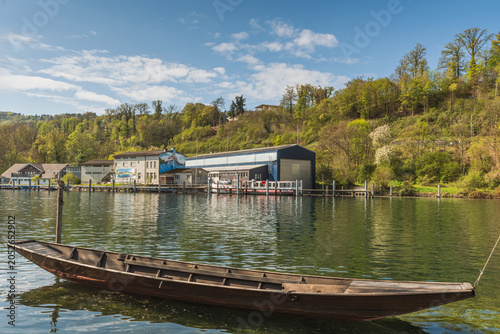 Obraz na plátně Traditional wooden Weidling boat on the Rhine near Schaffhausen, Switzerland