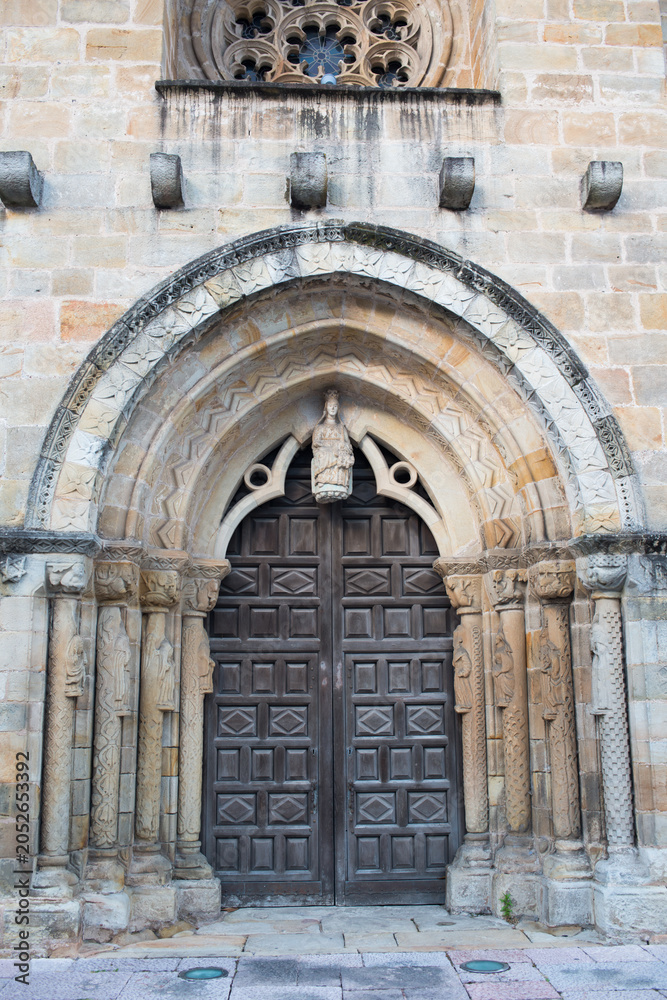 Fototapeta premium Main entrance to church of Santa Maria de la Oliva at Villaviciosa, Asturias, Spain.