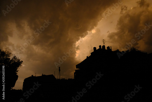 Stormy sky over buildings along via Piero della Francesca in Milan, Italy