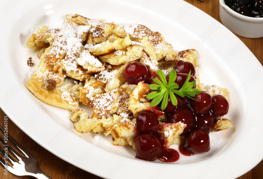 Fototapeta premium Food - Traditional Kaiserschmarrn - Austrian Pancake Pieces on white Background