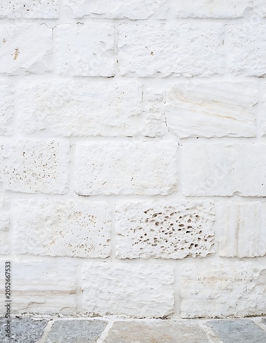 Textured White Brick Wall Surface Closeup.