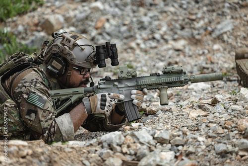 Canvastavla Military sniper aiming precision rifle during tactical reconnaissance mission in