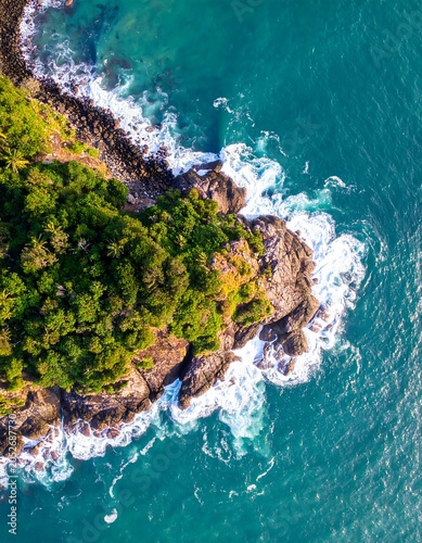 Aerial view of a lush green coastal island surrounded by blue ocean waters