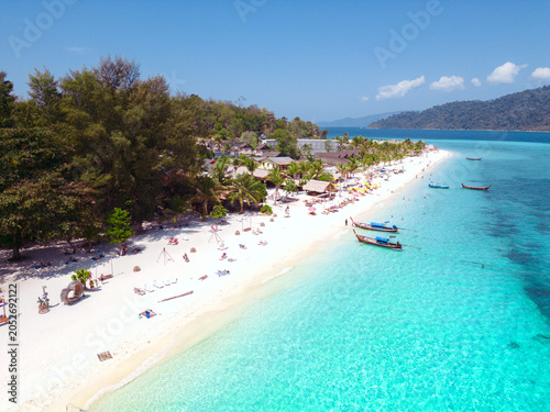 Aerial Drone View of Koh Lipe Island Beach with Turquoise Water and Longtail Boats, Thailand