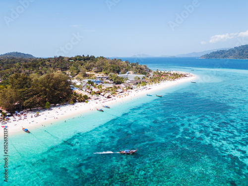 Aerial Drone View of Koh Lipe Island Beach with Turquoise Water and Longtail Boats, Thailand