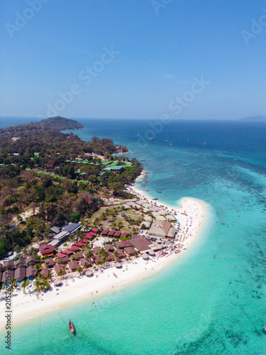Aerial Drone View of Koh Lipe Island, vertical photo with Turquoise Water and Longtail Boat and hotel , Thailand
