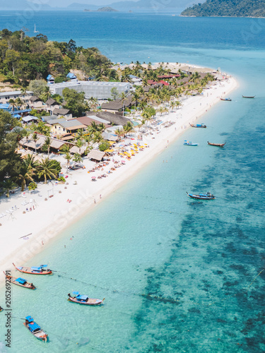 Aerial Drone View of Koh Lipe Island Beach with Turquoise Water and Longtail Boats, Thailand