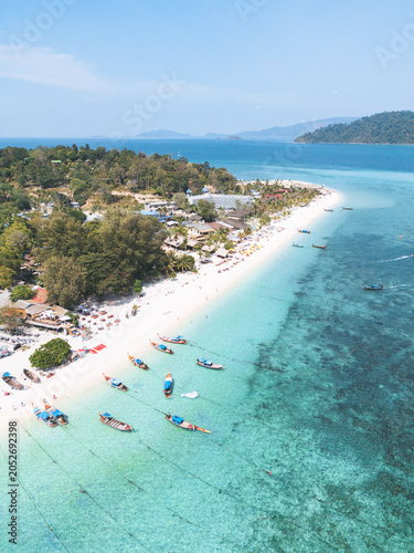 Aerial Drone View of Long tail Boats in Koh Lipe Island, amazing beach with Turquoise Water, Thailand