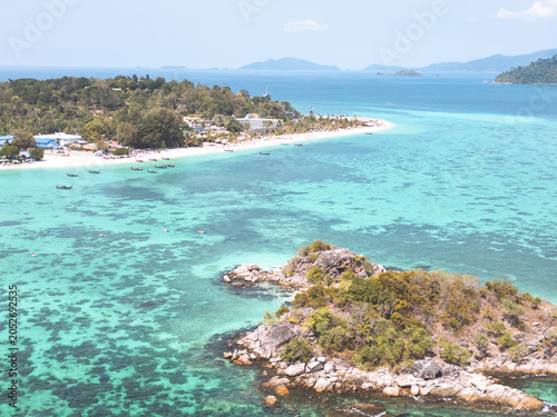Aerial Drone View of Koh Lipe Island Beach with Turquoise Water and Longtail Boats, Thailand