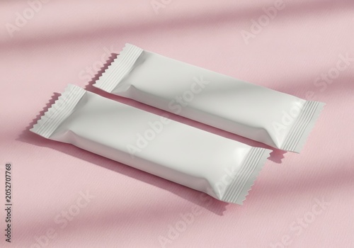 Two blank white food snack bar packaging wrappers on a pink background