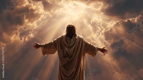 Jesus Christ with arms raised to the heavens in a divine light and clouds