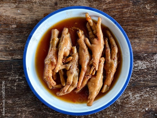 Top view of braised chicken feet in brown sauce