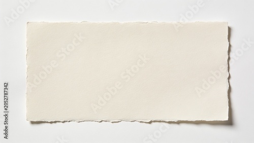 features a rectangular piece of blank, off-white paper with a slightly textured surface. The edges of the paper are uneven and slightly frayed, giving it a handmade or artisanal appearance. The paper 