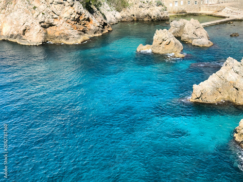 Close up of the harbor of Dubrovnik city in Croatia with Adriatic Sea, ancient buildings