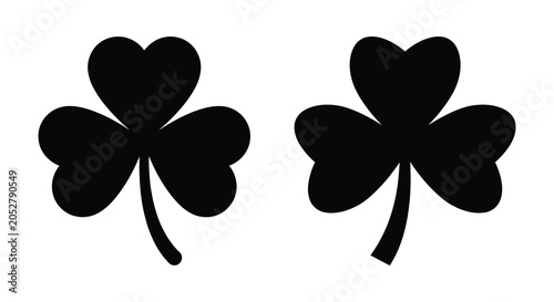 Tableau sur toile Two clover leaves with stems depicted as a black silhouette cloverleaf