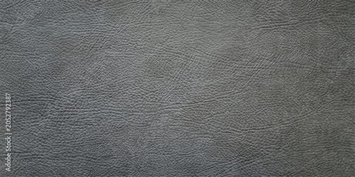 Foto A close-up, textured surface of dark gray leather showcases its natural grain and subtle sheen, offering a versatile background for design or material studies