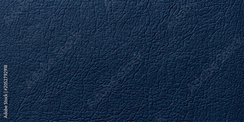 Quadro em tela A close-up macro photograph reveals the rich texture of a deep navy blue leather surface, showcasing its natural grain and subtle sheen, offering a tactile and luxurious feel
