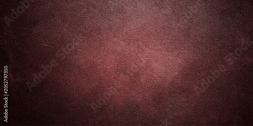 Bild auf Leinwand Textured dark red leather background with subtle variations in tone and grain, offering a rich and sophisticated visual