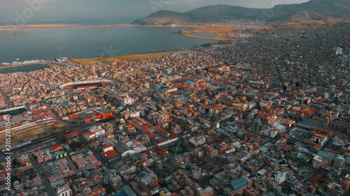 Drone view of Puno, a high-altitude city on the shores of Lake Titicaca in Peru. Urban districts and Andean landscapes surround the world’s highest navigable lake.