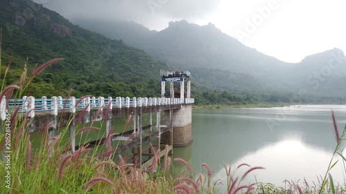 Scenic Canal Sluice Reservoir Amid Mountains and Greenery