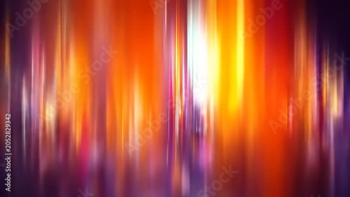 Abstract of blurred vertical light trails in a spectrum of vibrant colors, resembling a cityscape