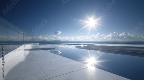 Bright sunlight illuminates a modern infinity edge pool overlooking distant water and landforms