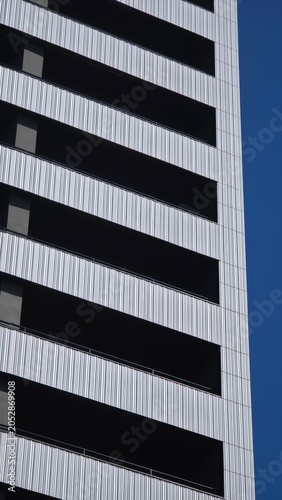 Modern building facade creating abstract striped pattern