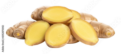 Fresh ginger root slices and whole rhizome pile with yellow flesh isolated transparent background image