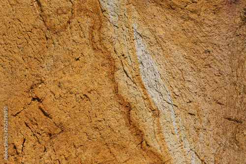 Fotografía Gossan (iron hat) formation from oxidized pyrite deposits in the Black Sea region, showing porous rusty orange and yellow iron oxide textures formed by weathering and acidification