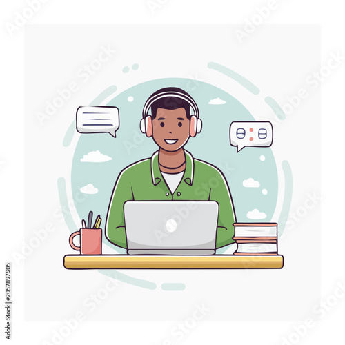 Man with headphones working on laptop with books and pen holder