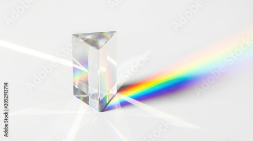 Crystal prism refracts white light into a vibrant rainbow spectrum, illustrating science and optics.