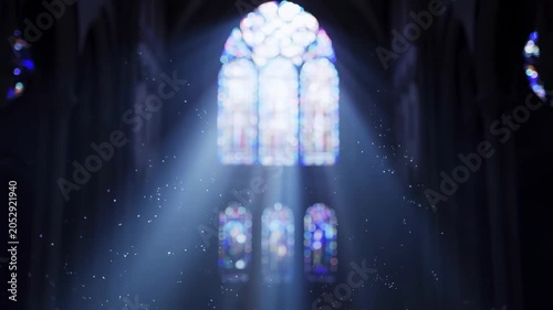 Sunlight streams through church windows illuminating dust particles in sacred space