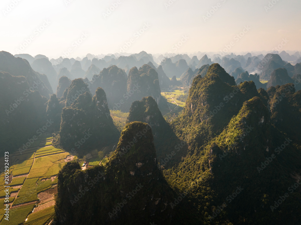 Obraz premium Breathtaking Aerial View of Karst Mountains in Guangxi, China at Sunrise