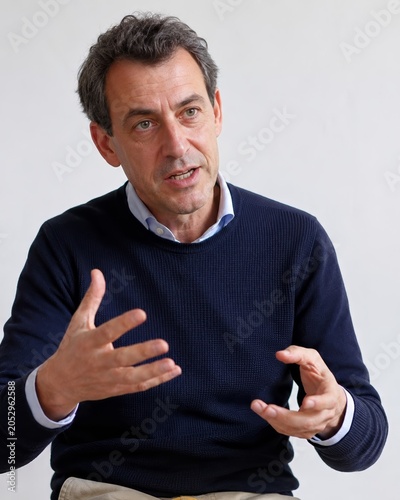 Caucasian businessman discussing corporate equality and diversity in office interview, middle aged corporate worker