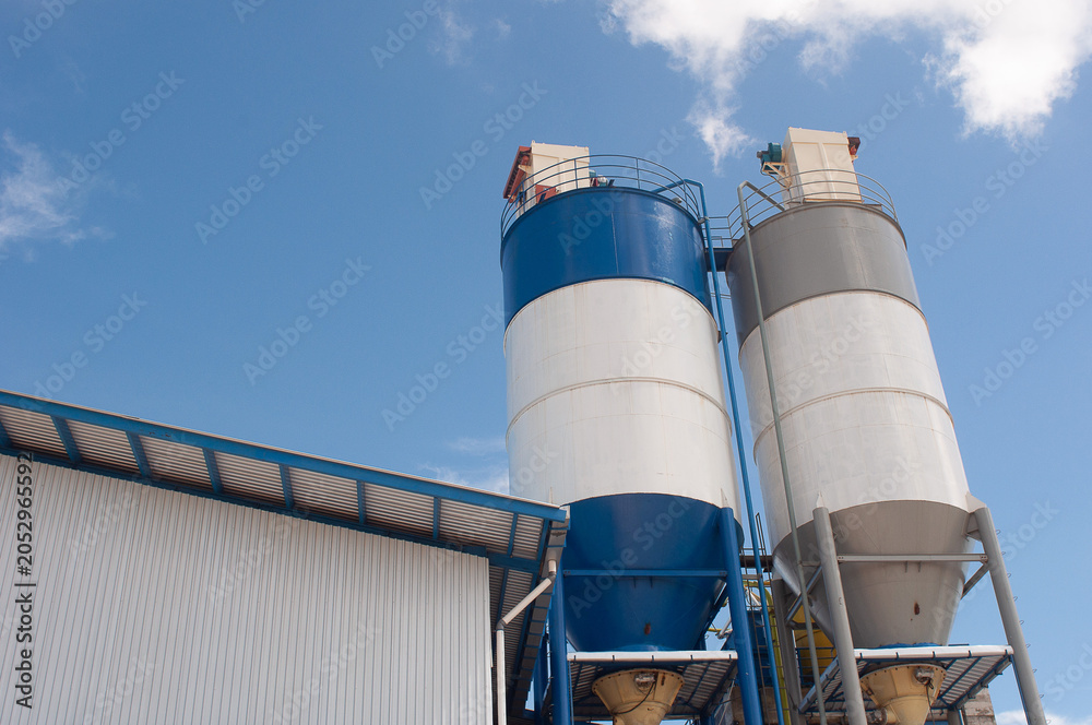 Obraz premium Two factory silos.