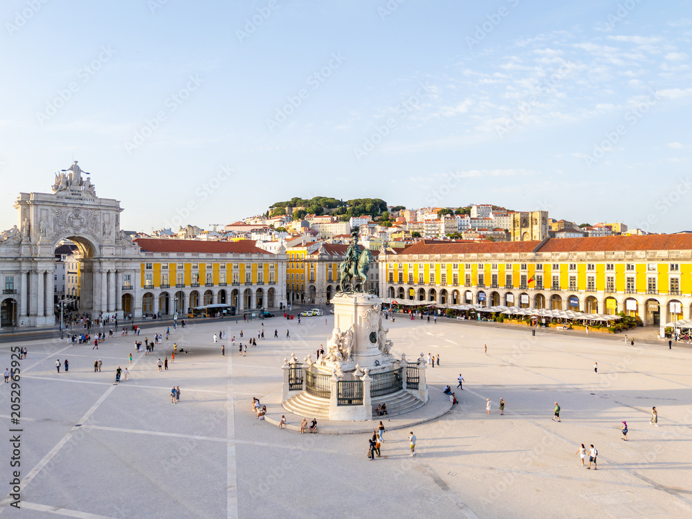 Obraz premium Lisbon City at Sunset. Commerce Plaza, Equestrian Statue, Tourists and Rua Augusta Arch. Portugal. Aerial Drone Shot