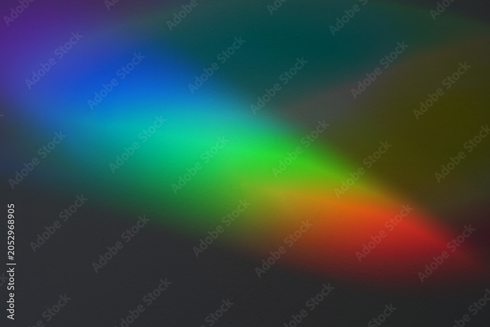 Fototapeta premium Soft focus rainbow neon noise grain blur texture prism reflection wall. Light and shadow smoke abstract gradient reflaction rays background.
