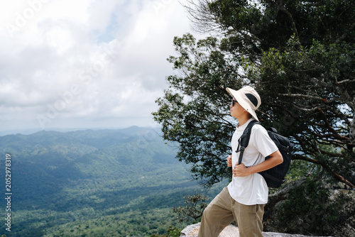 Bild auf Leinwand Young Hiker Enjoying Mountain View During Outdoor Adventure