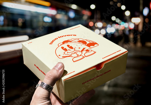 Hand Holding Food Delivery Box Mockup