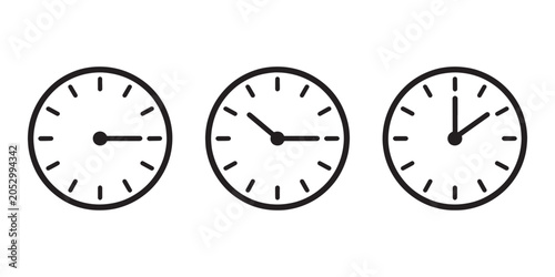 Three clocks with different times black and white clock faces hour