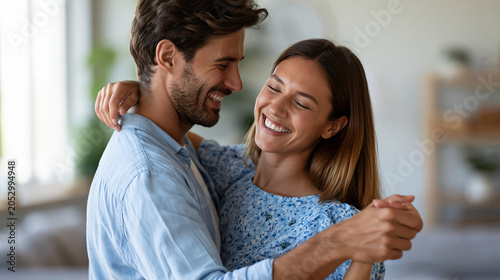 Anonymous couple laughing together while untangling a misstep during a self-taught swing dancing tutorial in a home living room, fun dance learning and relationship concept,