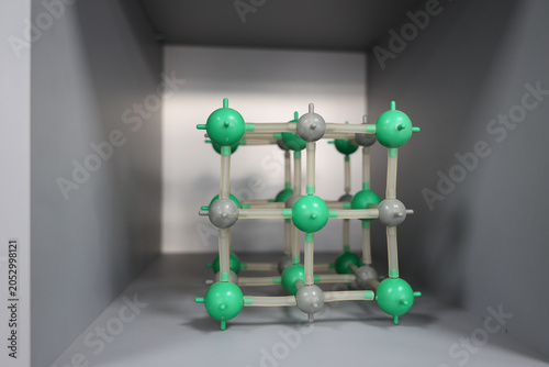 Crystal lattice model representing materials science, nanotechnology and molecular engineering. Scientific research concept related to chemistry, physics, advanced materials and innovation.