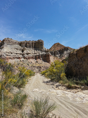 Desert canyon landscape in Granada Geopark with colorful cliffs