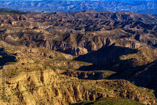 Vast badlands landscape in Granada Geopark with eroded canyons