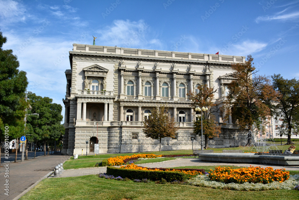 Fototapeta premium The Old Palace building in Belgrade, Serbia, with a beautiful park and fountain in the foreground.