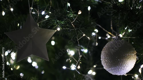 Christmas spruce tree decorated with balls and toys. New Year celebration. Closeup