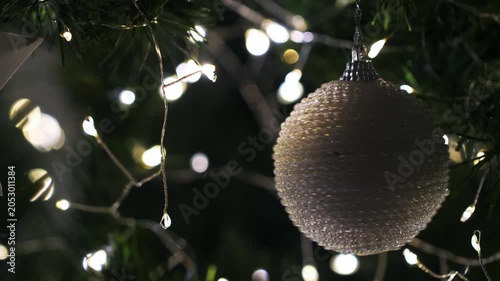 Christmas spruce tree decorated with balls and toys. New Year celebration. Closeup