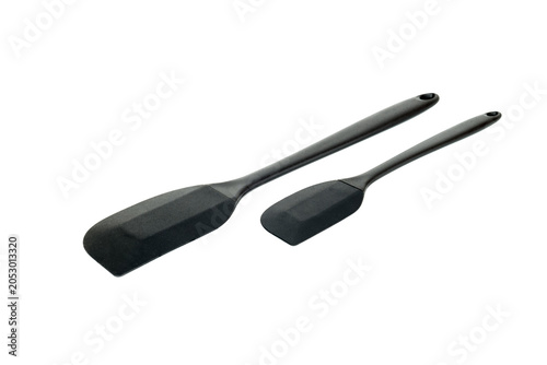 set of two black cooking spatulas on a white background