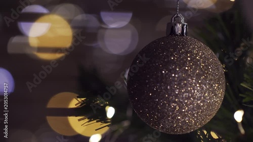 Christmas spruce tree decorated with balls and toys. New Year celebration. Closeup
