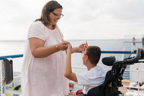 Mother and child with cerebral palsy enjoying cruise